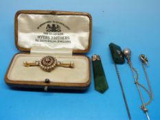 A yellow metal brooch marked 15ct set wi