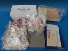 A box of GB stamps, loose and in stockbo