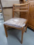 A set of eight golden oak Geneva chairs