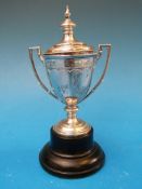 A small hallmarked silver trophy cup on