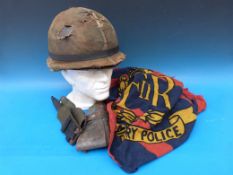 A British Military Police flag which flew outside the Police HQ in Port Stanley at the end of the