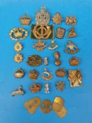 Twenty-six assorted British Army cap and collar badges including The Norfolk Regiment, Derbyshire,