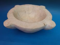 A large marble mortar with compass points