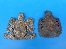 A Royal Crest plate 'Honi Soit Qui Mal y Pense' together with a bronze/brass example depicting two