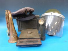 A .30 cal ammunition box, M6 periscope torch, helmet, bugle etc