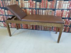 A vintage mahogany and faux leather doctor's examination couch