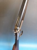 A George Gibbs 12 gauge side-by-side hammer action shotgun 28 inch barrels, serial number B7691.