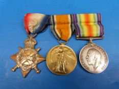 A set of three WW1 medals and ribbons awarded to 12829 Pte R McIntyre Gloucestershire Regiment