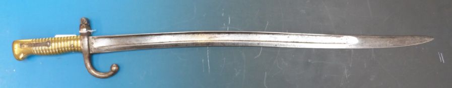 A French sabre bayonet with brass handle stamped T90947 marked to back of blade for 1871