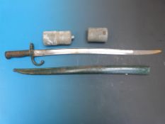 A French bayonet in scabbard together with a water bottle