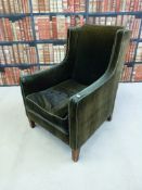 An early 19thC upholstered low wingback armchair