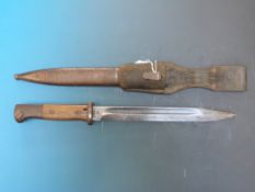 A German bayonet in scabbard, probably WWII, stamped 3193, JJ AND 43 asw