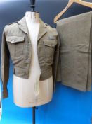 An Army officer's battle dress dated 1954, size 10, with lanyard and RAEC badges