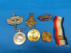 A WWI medal trio awarded to T - 1561 DVR A J Close ASC together with two Egypt cap badges, one