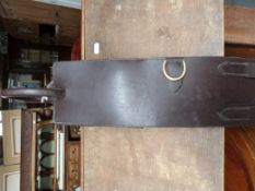 A Shires brown leather anti cast roller, new