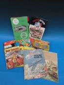 A collection of sporting books and ephemera ro include tea and other cards, comics and cricket