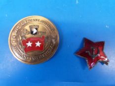 A Russian military cap badge, by repute swapped at Checkpoint Charlie for a Zippo lighter together