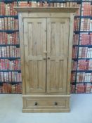 A pine wardrobe with drawer under (H 189cm x W 102cm x D 58cm)