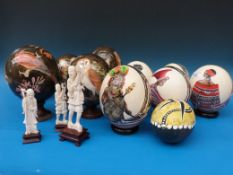 A collection of hand-painted and lacquer ostrich eggs
