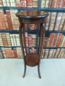 An inlaid mahogany jardiniere stand