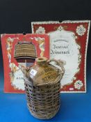 A stoneware Stroud Brewery beer flagon in basketwork container together with 1951 and 1952