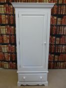 A painted pine wardrobe with single door and drawer under (H 196cm x W 86cm x D 56cm)