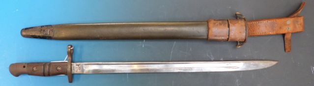 A 1917 Remington bayonet with leather scabbard