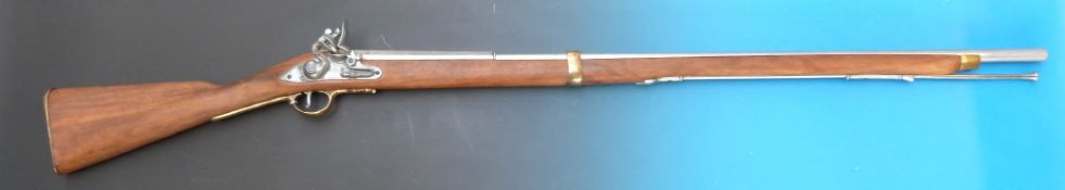 A replica 19thC flintlock rifle, the lock marked 