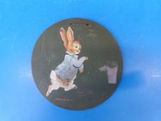 Beatrix Potter wooden circular plaque printed with colour image of Peter Rabbit with early advert