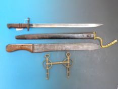 A WWI Remington bayonet dated 1913 and a machete