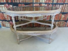 A pair of Italian style glass topped coffee tables with carved detail (H 46cm x L 132cm x W 72cm)