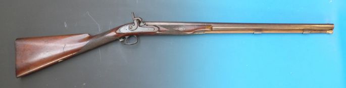 An 18 bore muzzle loading percussion rifle with engraved decoration chequered stock and forend with