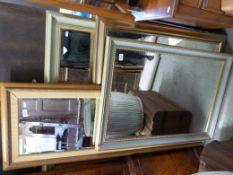 Four mirrors, three with bevelled glass, tallest 154cm