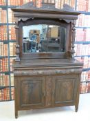 An Art Nouveau sideboard / display cabinet with mirror back, the based fitted with two drawers and