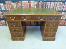 A leather inset twin pedestal desk