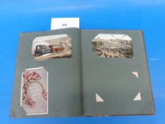 A vintage postcard album with mixed examples including WW1 comical, McGill, Mabel Lucie Attwell,