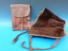 A German WW2 era leather map case together with a fur fronted marching bag marked E Glennerg 1943