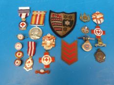 A quantity of medals relating to The Red Cross and others, including a long and efficient service