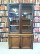 A 19thC glazed mahogany bookcase with dogs tooth adjustable shelves (214cm tall x 120cm x 46cm