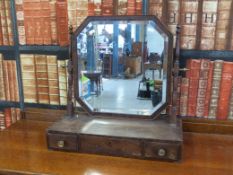 A mahogany swing framed mirror with three drawers to base