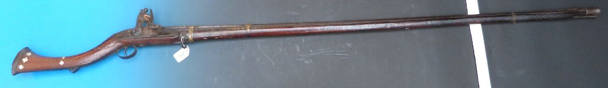 A 19thC Eastern frontier / Afghan musket with mother-of-pearl detail, extensive carved and inlaid