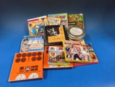 A collection of 8mm film reels including Laurel and Hardy, cartoon shows, Charlie Chaplin etc