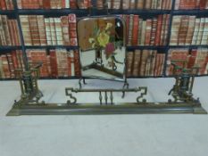 A brass fire fender together with a brass fire screen