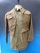 A Gloucestershire Regiment battledress, tunic and shirt dated 1946, size 13