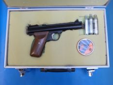 A Sheridan .177 air pistol with three spare Co2 canisters in metal flight case, serial number