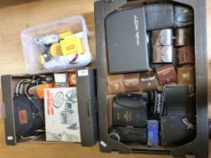Mixed cameras and photographic accessories in three boxes