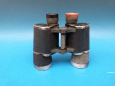 A pair of German Leitz binoculars marked beh KF and 10x50 374095 M H/6400 with further erased word
