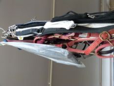 Ten assorted Cottage Crafts and other horse girths together with five Monty Roberts and other head