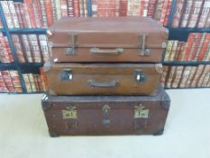 Three items of vintage leather / canvas luggage, two with many interesting stickers inside the lids