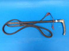 A Swaine and Adeney hunting crop with hallmarked silver collar and makers name on button to top,
